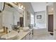 Bathroom featuring double sinks, a soaking tub, and great natural light at 25 Grange Way, Sharpsburg, GA 30277