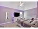 Comfortable bedroom featuring vaulted ceilings, a ceiling fan and decorative lighting at 25 Grange Way, Sharpsburg, GA 30277