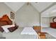 Bedroom with a comfortable bed, nightstands, and a dresser with mirror at 25 Grange Way, Sharpsburg, GA 30277