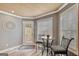 Breakfast nook features natural light, a table for two, and access to the exterior deck at 25 Grange Way, Sharpsburg, GA 30277
