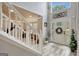 Inviting foyer with a high ceiling, modern flooring, and a view of the staircase at 25 Grange Way, Sharpsburg, GA 30277