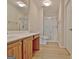 Bathroom featuring double sink vanity, a toilet, and a glass-enclosed shower at 430 Rehobeth Way, Fayetteville, GA 30214