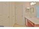 Well-lit bathroom with a vanity and a door leading to additional rooms at 430 Rehobeth Way, Fayetteville, GA 30214
