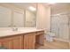 Bathroom featuring a vanity with a sink, toilet, and a shower with a glass door at 430 Rehobeth Way, Fayetteville, GA 30214