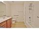 Bathroom features a single vanity with a cherry cabinet and tub/shower with a hand-held showerhead at 430 Rehobeth Way, Fayetteville, GA 30214