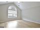 Well-lit bedroom with a vaulted ceiling, fan, and light wood flooring at 430 Rehobeth Way, Fayetteville, GA 30214