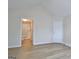 Bedroom featuring wood-look floors, neutral walls, and an ensuite bathroom at 430 Rehobeth Way, Fayetteville, GA 30214