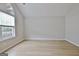 Spacious bedroom with a vaulted ceiling and a large window at 430 Rehobeth Way, Fayetteville, GA 30214