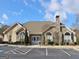 Community clubhouse features stone and siding exterior, flag pole, and mature landscaping at 430 Rehobeth Way, Fayetteville, GA 30214