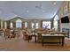 Community clubhouse common area featuring a fireplace, tables and seating at 430 Rehobeth Way, Fayetteville, GA 30214