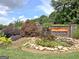 The Villas at Gingercake entrance sign with a stone waterfall feature and professional landscaping at 430 Rehobeth Way, Fayetteville, GA 30214