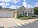 Well-maintained home featuring a two-car garage, stone accents, and neatly trimmed landscaping at 430 Rehobeth Way, Fayetteville, GA 30214