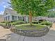 Inviting home exterior featuring a well-maintained yard, mature tree, and a charming facade at 430 Rehobeth Way, Fayetteville, GA 30214