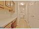 Hallway with built-in desk and cabinets that leads to the laundry area at 430 Rehobeth Way, Fayetteville, GA 30214