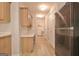 Hallway with wood-style floors leads to the laundry area, adding functionality and style at 430 Rehobeth Way, Fayetteville, GA 30214
