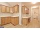 Hallway with built-in desk and cabinets that leads to the laundry area at 430 Rehobeth Way, Fayetteville, GA 30214