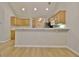 Kitchen with breakfast bar seating and ample cabinet and counter space at 430 Rehobeth Way, Fayetteville, GA 30214