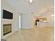 Open concept living area with fireplace, hardwood floors, and seamless flow to kitchen area at 430 Rehobeth Way, Fayetteville, GA 30214