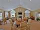 Comfortable lounge with vaulted ceilings, fireplace, large windows, and stylish seating arrangement at 430 Rehobeth Way, Fayetteville, GA 30214