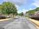 Quiet street view showcasing well-maintained homes and lush greenery in a suburban neighborhood at 430 Rehobeth Way, Fayetteville, GA 30214