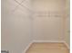 Walk-in closet with wood-look flooring and wire shelving installed at 430 Rehobeth Way, Fayetteville, GA 30214