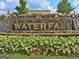 Gorgeous waterfall feature with landscaping creates an eye-catching entrance to the community at 430 Rehobeth Way, Fayetteville, GA 30214
