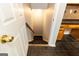 View of basement steps, with tile flooring, wooden cabinets, and a countertop along the side wall at 155 Glenwood Ln, Fayetteville, GA 30215