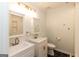 Bright bathroom featuring double sinks, gold fixtures, updated lighting, and a stylish honeycomb tile floor at 155 Glenwood Ln, Fayetteville, GA 30215