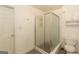 Bathroom featuring a glass shower stall, toilet, sink, and cabinet with storage at 155 Glenwood Ln, Fayetteville, GA 30215