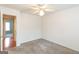 A carpeted bedroom with a ceiling fan provides a comfortable and inviting atmosphere for rest at 155 Glenwood Ln, Fayetteville, GA 30215