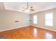 Large bedroom featuring hardwood floors, a ceiling fan, and natural light, offering a cozy and inviting atmosphere at 155 Glenwood Ln, Fayetteville, GA 30215