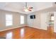 Comfortable bedroom with hardwood floors, a ceiling fan, and ample natural light, providing a relaxing retreat at 155 Glenwood Ln, Fayetteville, GA 30215