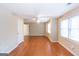 Bedroom with hardwood floors, ceiling fan, and plenty of natural light at 155 Glenwood Ln, Fayetteville, GA 30215