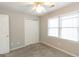 Cozy bedroom with plush carpet, ceiling fan, and bright natural light at 155 Glenwood Ln, Fayetteville, GA 30215