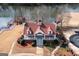 Stunning aerial view of the community clubhouse with red roof and lake in the background at 155 Glenwood Ln, Fayetteville, GA 30215