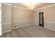 Elegant dining room with carpet flooring, chandelier lighting, and neutral color palette at 155 Glenwood Ln, Fayetteville, GA 30215