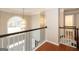 Open foyer with hardwood floors, natural light, and elegant light fixture at 155 Glenwood Ln, Fayetteville, GA 30215
