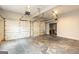 Spacious garage featuring two car bays, garage door openers, and a partially finished concrete floor at 155 Glenwood Ln, Fayetteville, GA 30215