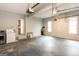 Garage featuring a laundry setup, two windows, and an unfinished concrete floor at 155 Glenwood Ln, Fayetteville, GA 30215