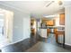 Well-lit kitchen with stainless appliances, granite counters and ample wood cabinets at 155 Glenwood Ln, Fayetteville, GA 30215