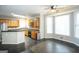 Kitchen with wooden cabinets, black countertop island, and stainless steel appliances at 155 Glenwood Ln, Fayetteville, GA 30215