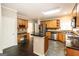Spacious kitchen features wood cabinets, stainless steel appliances, and granite countertops at 155 Glenwood Ln, Fayetteville, GA 30215