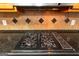 Gas cooktop with black granite countertops at 155 Glenwood Ln, Fayetteville, GA 30215