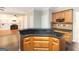Kitchen island with granite countertop and wood cabinetry at 155 Glenwood Ln, Fayetteville, GA 30215