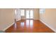 Living room featuring hardwood floors and glass doors at 155 Glenwood Ln, Fayetteville, GA 30215
