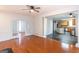 View from living room to kitchen, featuring hardwood floors and stainless appliances at 155 Glenwood Ln, Fayetteville, GA 30215