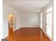 Spacious living room with hardwood floors, large windows, and french doors to the next room at 155 Glenwood Ln, Fayetteville, GA 30215