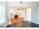 Open-concept living room with hardwood floors, fireplace and lots of natural light at 155 Glenwood Ln, Fayetteville, GA 30215