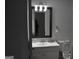 Bathroom with a dark framed mirror, vanity and toilet at 3281 Nina Way, Douglasville, GA 30135