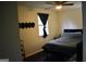 Bedroom with a ceiling fan, window and a bed with gray bedding at 3281 Nina Way, Douglasville, GA 30135